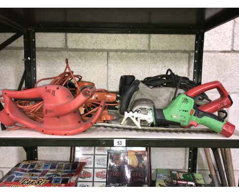 A quantity of electric gardening hand tools including hedge cutters, saw etc.