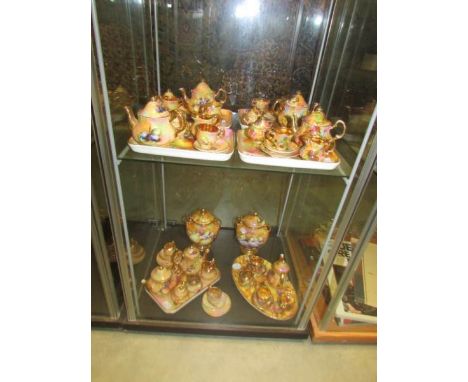 6 miniature tea/coffee sets with 2 urns in floral decoration by Claytondale (Royal Worcester Style).