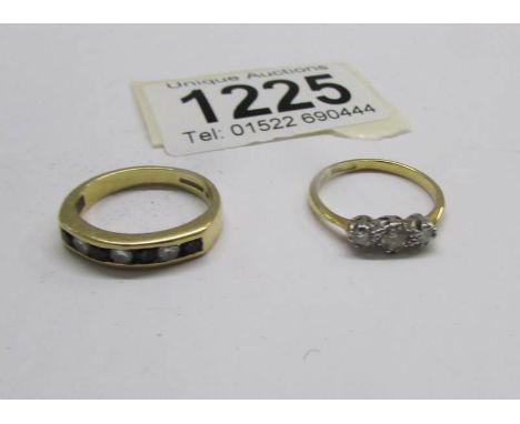 An 18ct gold sapphire and diamond band ring, size K and an 18ct gold set set 3 diamonds, size J.