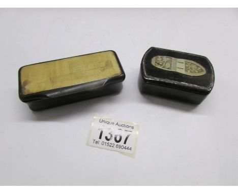 A snuff box with ivory inlay and a snuff box with depiction of a church.