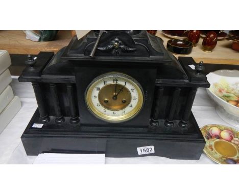 A Victorian black slate Palladian style mantel clock..