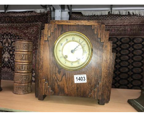 An oak art deco style clock.