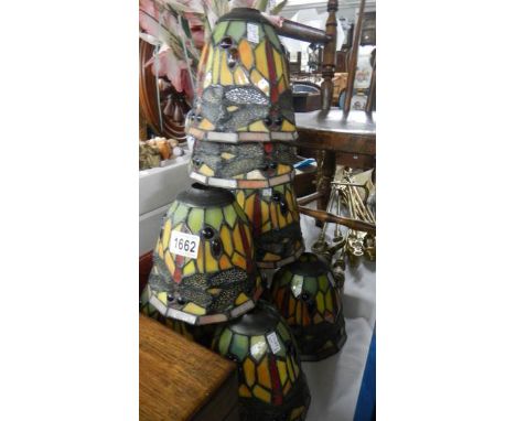 8 matching Tiffany style lamp shades.