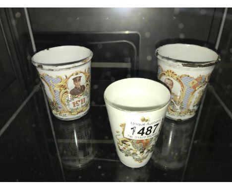 A Victorian crested porcelain beaker and 2 Edwardian enamel beakers.