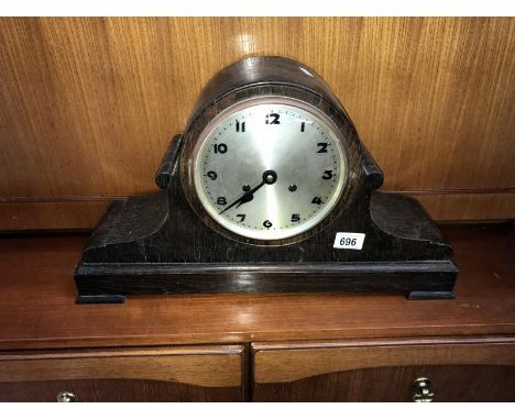 A large oak cased striking mantel clock