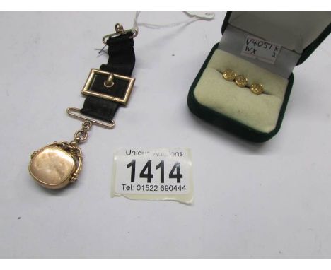 3 9ct gold evening dress studs, Birmingham 1891 (approx. 2 g) and a 9ct gold evening watch fob featuring a photograph locket,