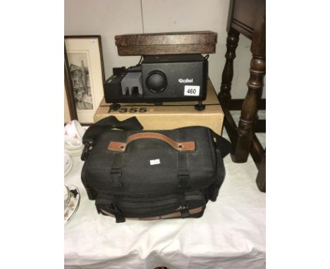 A Rollei slide projector and a JVC compact VHS camera