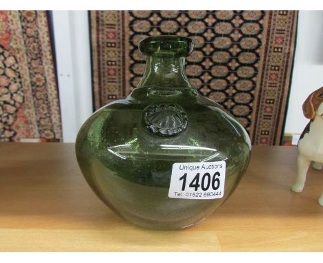 An Erik Hoglund green art glass vase with label.
