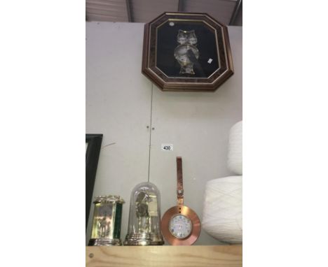 An owl effect wall clock, a carriage clock, an anniversary clock and one other