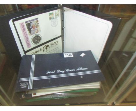 2 albums of first day covers and an album of coin first day covers.