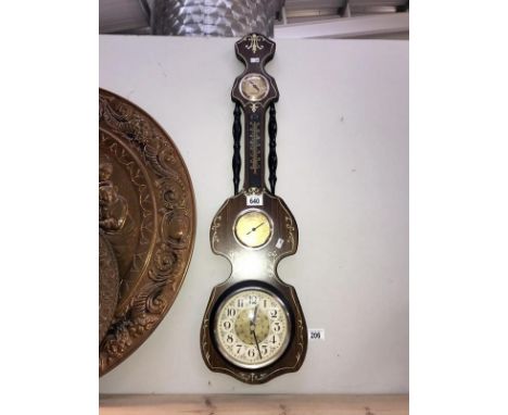 A modern wall clock barometer