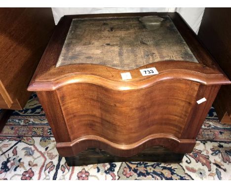 A carved wood box commode