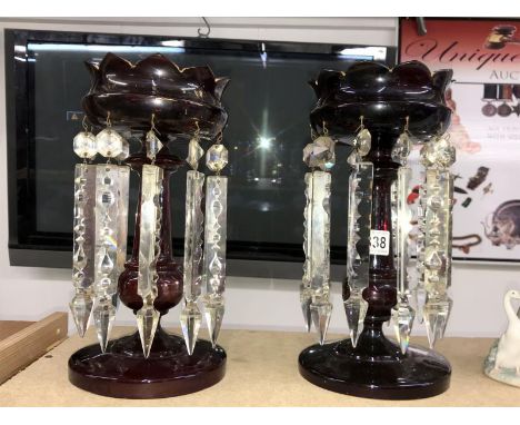 A pair of ruby glass lustres with droppers (decoration worn).