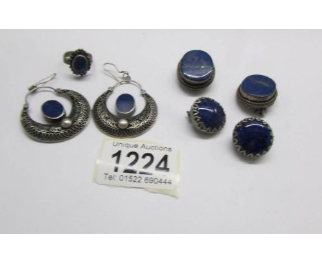 A collection of white metal jewellery set with lapiz lasuli including earrings and ring.