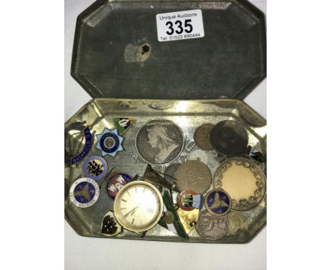 A Queen Elizabeth II coronation tin with some old enamel badges and 19th and 20th Century coins including an 1893 silver crow