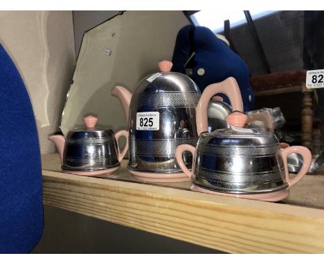 A vintage teapot, milk jug and sugar bowl