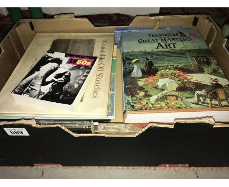 A box of assorted art books