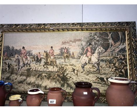 A small framed tapestry hunting scene