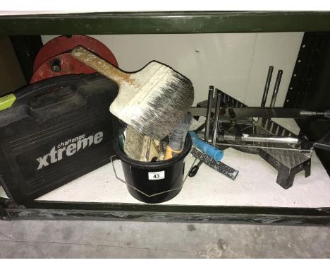 A small collection of DIY hand tools including decorating items