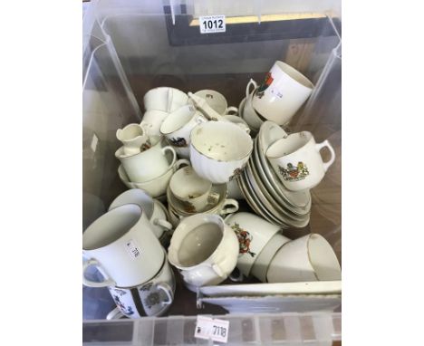 A large quantity of crestedware including various cups and saucers sets