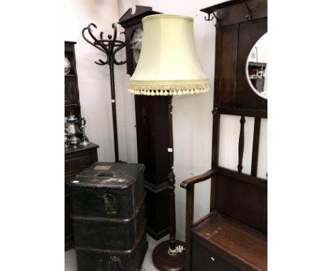 A lamp stand with shade