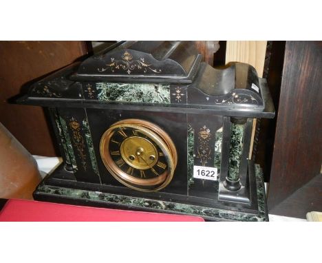 A Victorian black Palladian style mantel clock.