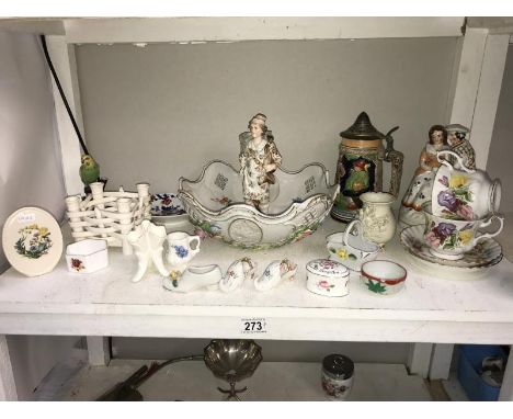 A shelf of porcelain ornaments, bowls, cups &amp; vases etc.