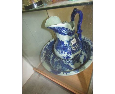 A blue and white jug and basin set.
