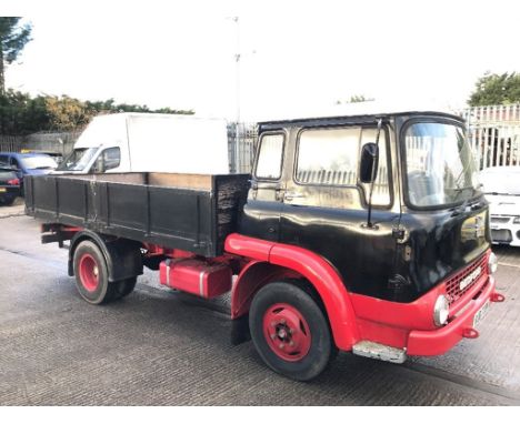 A 1974 Bedford TK 330 lorry, registration number RJB 739M, red and black. This Bedford lorry was originally fitted with a pet