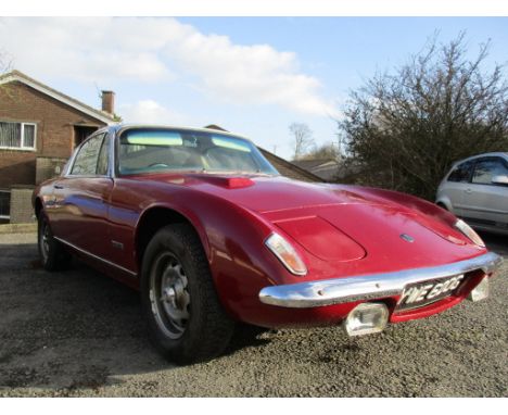 A 1969 Lotus Elan Plus 2 S, registration number YWE 600G, maroon and silver.  The Lotus Plus 2 was the start of Colin Chapman