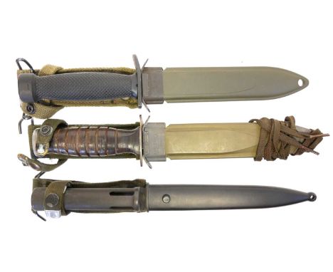 Two USM8 fighting knives and scabbards, and a FAL type C bayonet and scabbard. Two USM8 fighting knives and scabbards, (one m