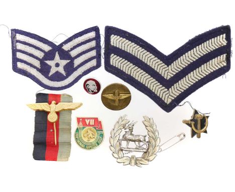 Collection of badges and patches Collection of badges and patches, to include a Kriegsmarine 'Donald Duck' cap badge with col