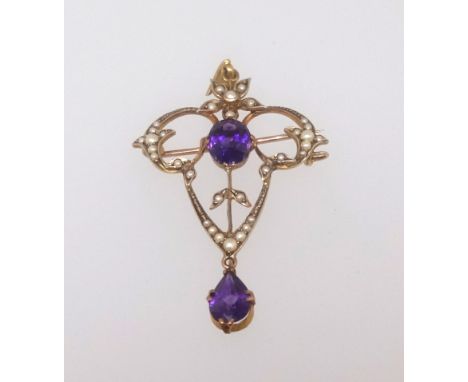 A 9ct antique pendant brooch set with amethyst and seed pearl.