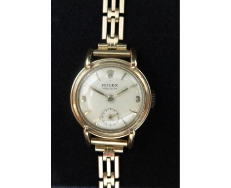 Rolex, a vintage ladies 9ct gold Rolex watch with a 9ct gold bracelet, the dial marked 'Precision' with sub-second dial, appr