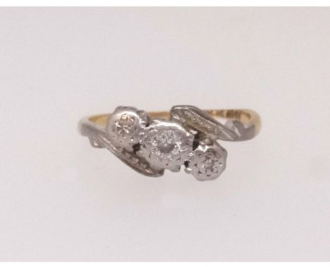 An 18ct antique diamond three stone ring, finger size K.
