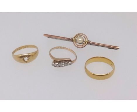 A 22ct wedding band, an 18ct five stone diamond ring and a 18ct ring (lacking stone) also a 9ct pearl set 'target' (4)