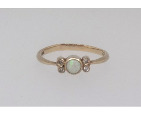 A 9ct opal and diamond set dress ring, finger size N.