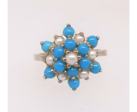 A 9ct turquoise and pearl cluster ring, finger size P.