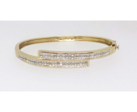 A fine 18ct diamond cross over bangle, approx diamond weight 2.00ct.
