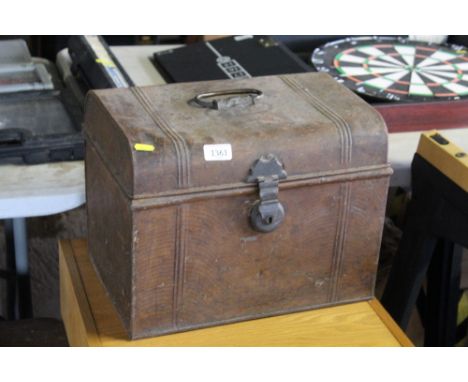 A Japanned trunk of small proportions 