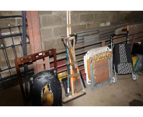 A bundle of long handled gardening tools