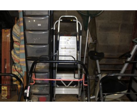 An aluminium step ladder together with a metal and plastic step ladder 