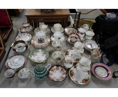 A collection of decorative china to include cups; saucers; trios; Royal Albert "Old Country Roses" etc