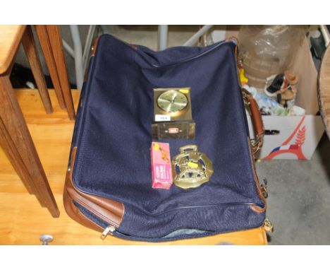 A bag; a clock; a dolphin bathroom robe hook