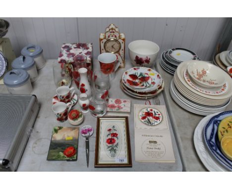 A collection of poppy decorated items to include glass, china, clock, pictures etc.