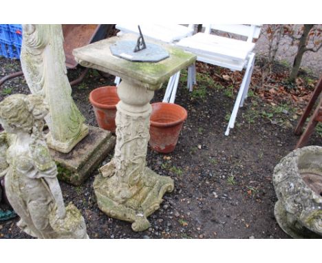 A concrete sundial raised on a plinth AF