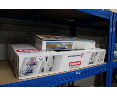 A Mario Kart Scalextric set and Best Lock model helicopter 