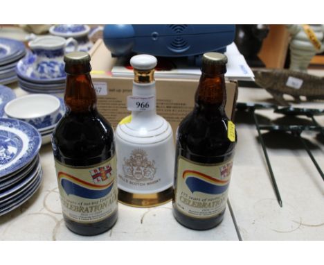 A Wade Bells Scotch whisky decanter and contents and two bottles of celebration ale 