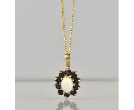 A 9ct Gold Mounted Opal and Sapphire Pendant on 9ct Gold Chain, Central Opal Cabochon Measuring 7.5mm by 4.8mm, 19mm by 11mm 
