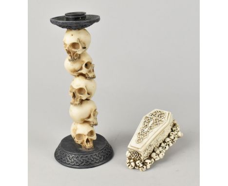 A Resin Candlestick the Support Modelled with Piled Skulls, 19cms High, Together with a Small Resin Box in the Form of a Coff